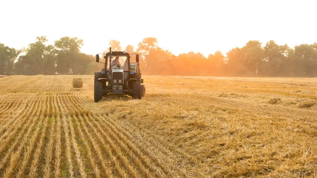farmer making hay bales